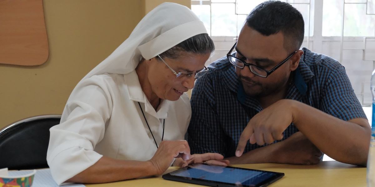 Photo of two SPOON trainees using Count Me In.