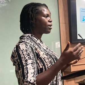 Photo of SPOON's Nutrition Technical Officer, Lorna Namususwa giving a presentation